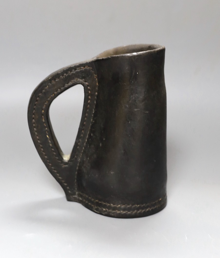 A Leather blackjack jug, 19.5 cms high.